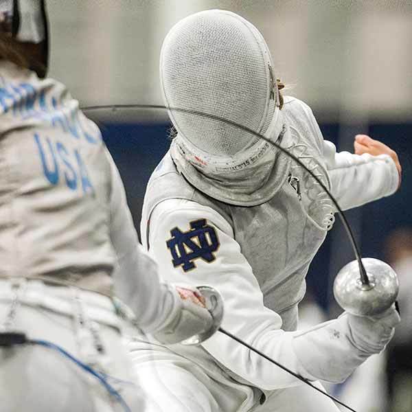 Photo of two students fencing